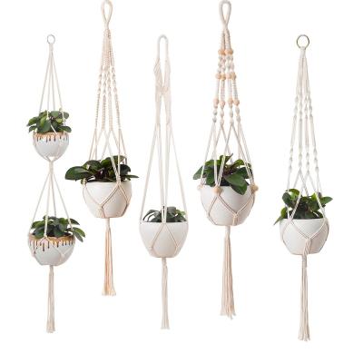 China Handmade Macrame Plant Hanger Customize Logo Handmade Woven Basket Cotton Rope Flower Pot Hook Plant Package Indoor Hanging Planter for sale