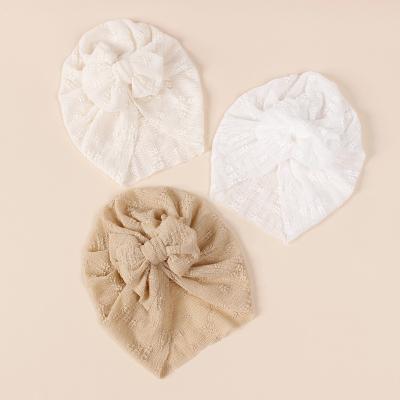 China New Baby Summer Casual Embroidery Bow Elastic Beanie Hats Newborn Girls Soft Bow Hair Accessories for sale