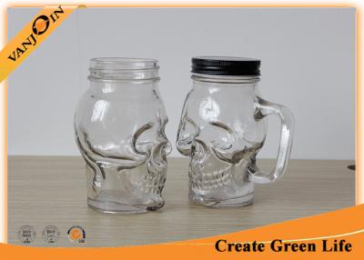 China Clear Skull Head 16oz Mason Glass Jar with Metal Screw Cap / Mason Jar Glasses With Handles for sale