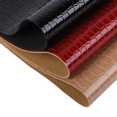 China Waterproof Wear Resistant Embossing Faux Leather PU Synthetic Crocodile Grain Leather Rolls Printed for sale