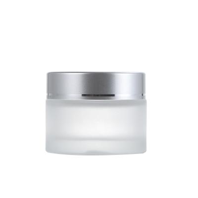 China 50ml cosmetic frosted glass cosmetic jar with aluminum lid for sale