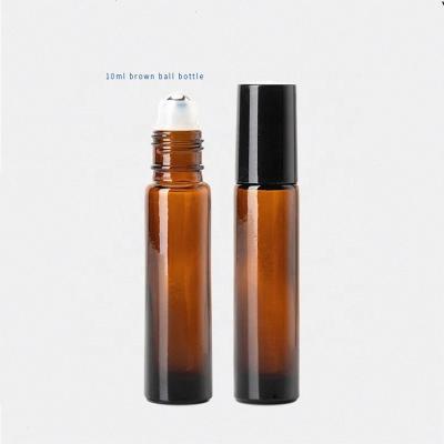 China 10ml empty cosmetic amber screw cap round glass roll on perfume bottle with lid for sale