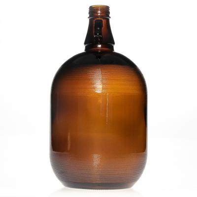 China Beverage 4 Liter Large Capacity Amber Glass Bottle Beer Bottle Carrier With Cap for sale