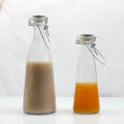 China Eco-friendly Recyclable Vintage 500ml 1000ml Swing Milk Glass Bottle Top Clear Color With Ceramic Clip Lid for sale