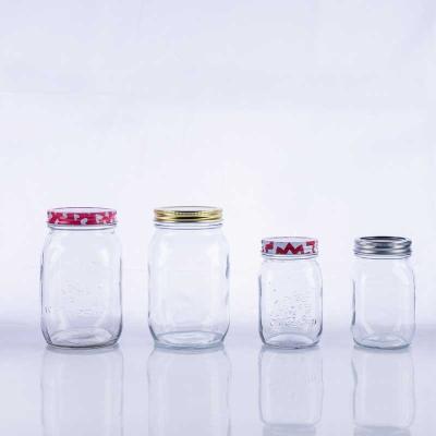 China Wholesale 16 Ounce 32 Ounce Fresh Keeping Custom Embossed Glass Mason Jars With Metal Lid for sale