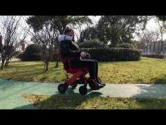 A Classic electric wheelchair, can be driven on plastic tracks, turns