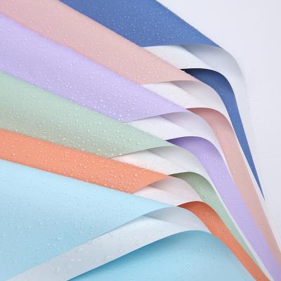 China Waterproof Wholesale Double Color Plastic Wrapping Paper Film Flower Double Sided Kraft Paper for sale