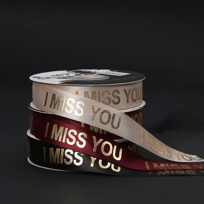 China Floral Custom Black Polyester Valentine's Day Logo Ribbon Gold Foil Grosgrain Printed Ribbon For Flower for sale