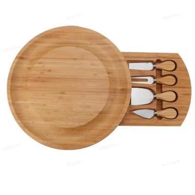 China Disposable Round Bamboo Kitchen Cheese Board With 4 Knife Wooden Cheese Board With Ceramic Bowls for sale