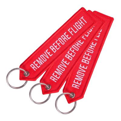 China Embroidered Cessna Embroidered Keychain REMOVE BEFORE FLIGHT Key Chain Arrow Shape Embroidery Key Indicator Flight Gift keychains 2020 for sale