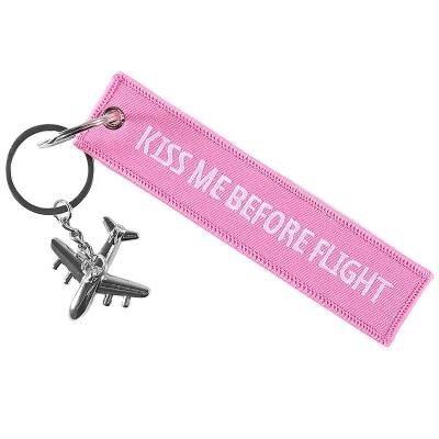 China Promotion Gift Pink Kiss Me Before Flight Keychains Aircraft Model Metal Gift Keyring For Aviation Enthusiast for sale