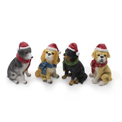 China Christmast Ornament Small Christmas Ornament Kids Gift Desk Decoration Resin Dog Figurine With Christmas Hat for sale