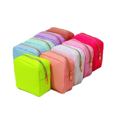 China Running Pale Pink S M L XL Mini Small Nylon Pouch Cosmetic Toiletry Travel Bride Gift Pouch Bright Color Reusable Designer Makeup Bags for sale