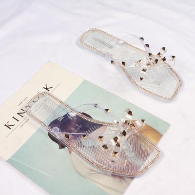 China Fashion Trend Baiyi Summer Beach Plastic Shoes Garden Slippers Flip Flops Woman Rivet Jelly Beach Sandals Flat Bow for sale