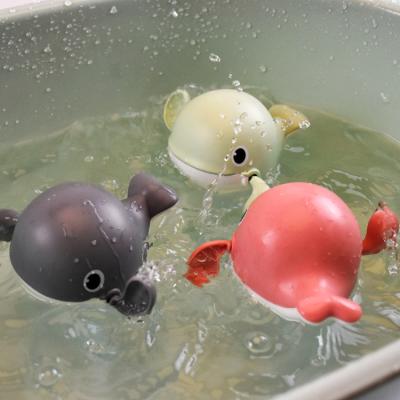 China Funny Kid Baby Bathroom Toys Water Floating Egg In Bathroom Kids Playing Whale Wind Up Toy for sale