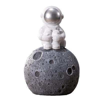 China Creative Cartoon Astronaut Resin Home Decorations Ornament Simple Modern Living Room Decoration Soft Open Coin Money Bank for sale