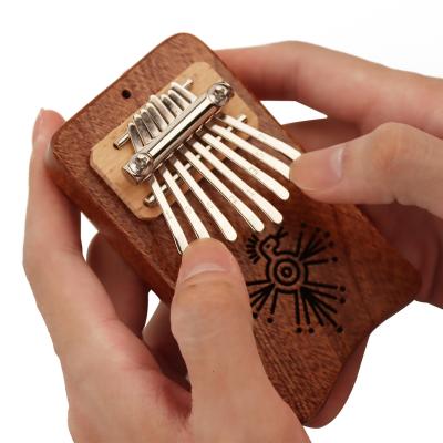 China GIF Accessory Kalimba 8 Mini Exquisite Musical Marimba Piano Thumb Good Class Finger Pendant Kalimba (Red-Brown) for sale