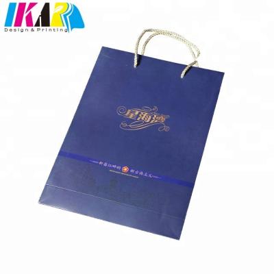 China Disposable Blue Color Printing Custom Paper Bag With Gold Foil Stamp for sale