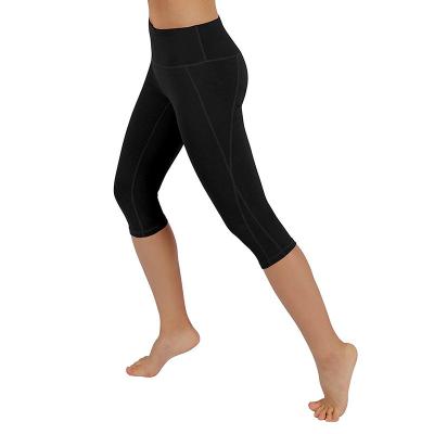 China Breathable In-Stock Supply Cropped Pants Side With Pockets Waist High Hips Gaiters Sexy Yoga Pants Women for sale