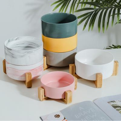 China Viable Custom Logo Marble Pattern Ceramic Pet Bowl With Wooden Stand Holder for sale