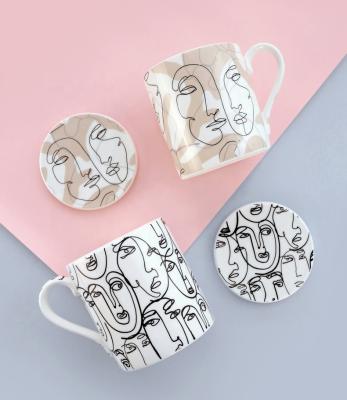 China Good Quality Fashionable Abstract Viable Wholesale Customized Black White Face Ceramic Coffee Mug for sale