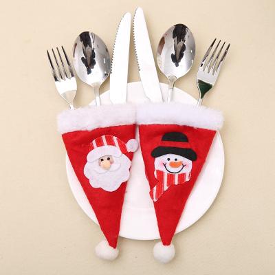 China Christamas Decoration 2021 New Christmas Decorations Knife And Forking Small Santa Claus Hat Non-woven Fabric And Christmas Snowman Hat Table Decoration for sale