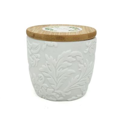 China LTC16 4.8oz Colorful Flame Soy Wax Scented Candle in Leaves White Embossed Ceramic Jar with Bamboo Lid for sale