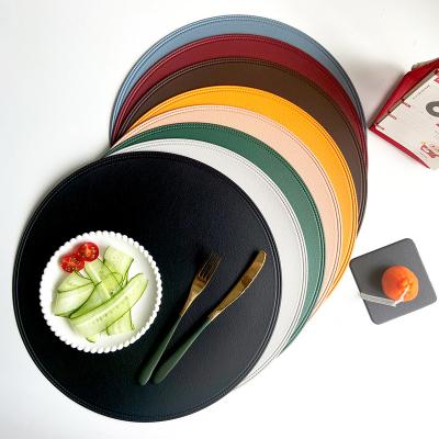 China Creative Hotel Dish Mat Place Artificial Leather Edge Pressure Plate Cushion Coaster 38cm Round Cushion Viable for sale