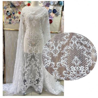 China Viable wholesale direct wholesale fashion wedding white bridal lace fabric french net dress fabric for brides for sale