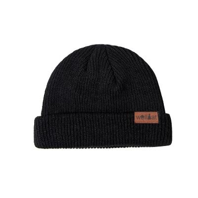 China COMMON Skull Caps Mens Winter Skull Cap Knitted Hat Unisex Beanies With Leather Label for sale