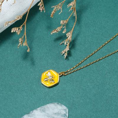 China Trendy Kolye Enamel and 18k Yellow Gold Plated Brass Bee In Hexagon Coin Medal Necklace Fashion Pendant Jewelry For Women for sale