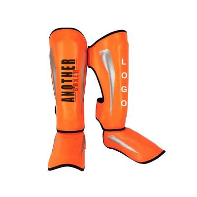 China 2021 Wholesale High Quality Leather Leg Muttahida Majlis-e-Amal Shin Pads Muttahida Majlis-e-Amal Kickboxing Guard Muay Thai Kickboxing Shin Guard for sale