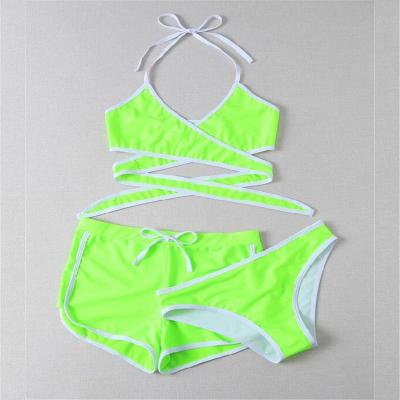 China 2021 trunks swimsuit lift up black/green women breathable 3 pieces halter crisscross bikini sets with swim shorts pants swimwear for sale