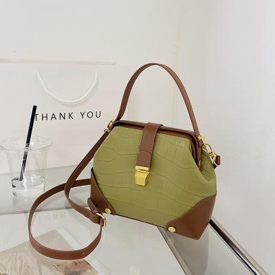 China Young Ladies' Must-Have CANDY Pattern PU Leather Lock Bag with Fashion Design for sale