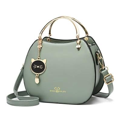 China Trendy Single Shoulder Women's Handbag with Cat Pendant and Zipper Closure for sale