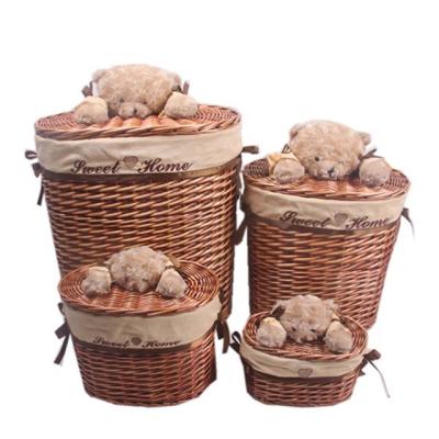 China Large Cheap Lidded Oval Household Goods Wicker Laundry Baskets With Toy Animal Handle Set Of 4 for sale