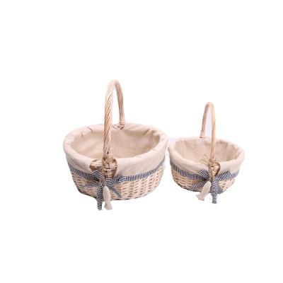 China Sustainable Oval Handmade Wicker Basket Gift Willow Basket With Handles Set Of 2 for sale