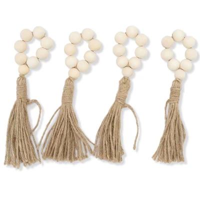 China Vintage Viable Handcrafts Natural Wood Beaded Napkin Ring For Party Home Wedding Reception Dining Table Setting With Linen Tassel for sale