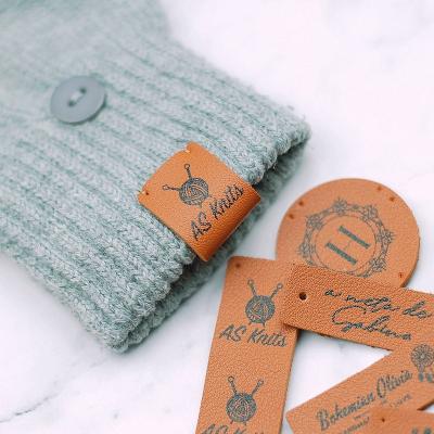 China Personalized Customized Apparel Washable Printed PU Leather Labels Fold Leather Labels Knitting Branding Labels for sale