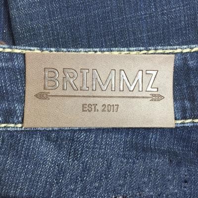 China Washable Customized Embossed Leather Jeans PU Label Iron On Tag Printed Rectangle Faux Leather Labels Debossed Garment Label for sale