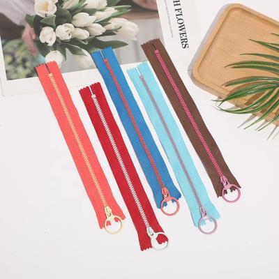 China Viable Custom Plastic Zippers With Lift Ring Zippers #3 Colored Resin Round Zipper for sale