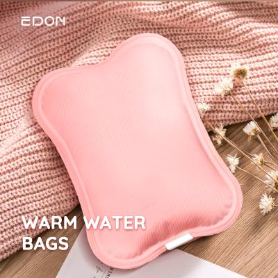 China Edon Automatic Strong Protection Power Cut-off Hot Water Bottle Bag PVC Charging Hot Water Bag Electric Hand Heater Health Care Pink/Brown Indoor Use for sale