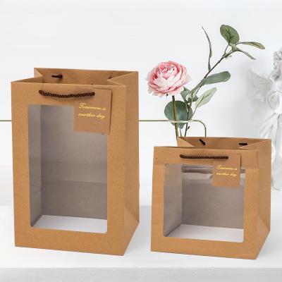 China Recyclable Portable Bouquet Packaging Waterproof Clear Eight Side Sealing Kraft Paper Portable Gift Bag With Window for sale