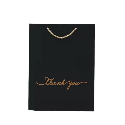 China Recyclable luxury packaging prints its own gold foil logo for small portable shopping paper bags for jewelry bag paper for sale