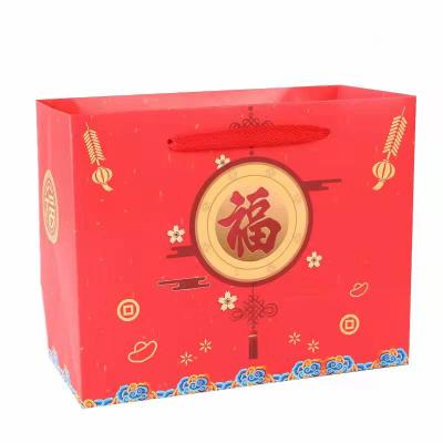 China Stain Company Annual Meeting Clothing New Year Craft Chinese Paper Bag Recyclable Red Party Gift for sale