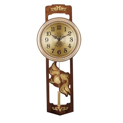 China Vintage Yiwu Huifeng style antique brass alloy wall decorative simple face pendulum swing tail wall clock for sale