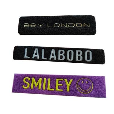 China Custom Viable Custom Embossed Logo Jeans TPU Label And Tags For Garment Bags Shoes Tops OEM Customized for sale