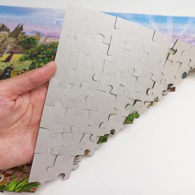 China 100% eco-friendly passes ASTM prop65 customized jigsaw factory 300piece paper puzzle with luxury carton package box gery and blue carton puzzle are available for sale