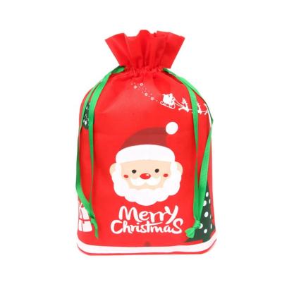 China 2021 Hot Sale Christmas Folding With Customized Logo Sublimation Red Christmas Santa Gift Bag Drawstring Nonwoven Bag for sale