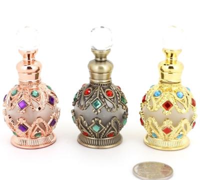 China 15ml Personality Personal Care Decoration Handmade Luxury Small Glassware With Gold Metal Cover Empty Perfume Bottles for sale